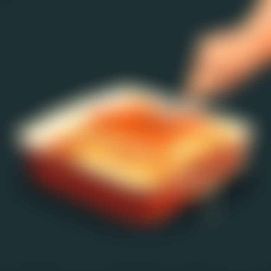 A piece of lasagna being removed from the oven and left to rest